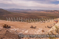 Panoramic view of Green River Stone Company's fossil quarry near Kemmerer, Wyoming, USA. This ancient lakebed contains fossils that date back to Eocene in the Green River Formation of southwestern Wyoming. Fossil Butte National Monument can be seen on the skyline in the background in the upper right corner of this photo.